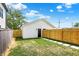A stepping stone path leads to the detached garage in this fenced in backyard at 2013 Yandes St, Indianapolis, IN 46202