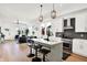 Open-concept kitchen featuring stainless appliances, a breakfast bar, and bright, natural light at 2013 Yandes St, Indianapolis, IN 46202