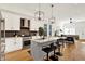 Bright, open kitchen with stainless appliances, center island, and bar seating at 2013 Yandes St, Indianapolis, IN 46202