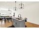 Kitchen island with sink and seating, modern pendant lights, in an open-concept living space at 2013 Yandes St, Indianapolis, IN 46202