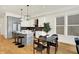 Modern kitchen with white cabinets, stainless steel appliances, and a central island, complemented by a dining area nearby at 2013 Yandes St, Indianapolis, IN 46202
