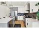 Bright kitchen with modern cabinetry, stainless steel appliances, and a sleek black backsplash at 2013 Yandes St, Indianapolis, IN 46202