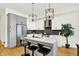 Stylish kitchen with stainless steel appliances, center island with bar seating, and pendant lighting at 2013 Yandes St, Indianapolis, IN 46202