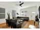 Bright living room featuring a stylish grey sofa, contemporary decor, and an inviting atmosphere with ample natural light at 2013 Yandes St, Indianapolis, IN 46202