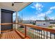 Inviting covered porch features wood decking and decorative metal railing at 2013 Yandes St, Indianapolis, IN 46202