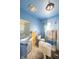 Bathroom with blue walls, awaits personalization and finishing touches at 207 S Center St, Plainfield, IN 46168