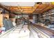 Spacious garage filled with supplies, featuring a wood ceiling and ample storage space at 207 S Center St, Plainfield, IN 46168