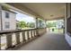 View of the porch and neighborhood with detailed columns, offering an outdoor space at 207 S Center St, Plainfield, IN 46168