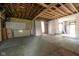 Interior view with exposed beams, showing potential for customization at 207 S Center St, Plainfield, IN 46168