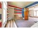 Room with striped walls and wood flooring, offering an open space at 207 S Center St, Plainfield, IN 46168
