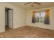 Cozy bedroom featuring neutral carpet, a ceiling fan, a window, and a connecting door to another room at 2416 Foxtail Dr, Plainfield, IN 46168