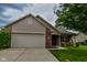 Charming two-story home with a brick facade, siding, attached garage, and a well-manicured front lawn at 2416 Foxtail Dr, Plainfield, IN 46168
