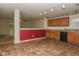 Spacious eat-in kitchen with abundant cabinetry, tile floors, and adjacent access to the backyard at 2416 Foxtail Dr, Plainfield, IN 46168