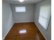 Bedroom featuring hardwood floors, a window, and neutral walls at 2435 Asbury St, Indianapolis, IN 46203
