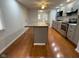 Spacious kitchen with island, hardwood floor, and stainless steel appliances at 2435 Asbury St, Indianapolis, IN 46203