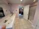 En-suite bathroom with double sinks, a large mirror and a glass-enclosed shower showcasing modern fixtures at 2635 Red Admiral Ln, Lebanon, IN 46052