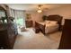 Spacious bedroom with plush carpeting, a ceiling fan, and classic wooden furniture at 2635 Red Admiral Ln, Lebanon, IN 46052