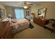 Comfortable bedroom with a queen-sized bed, natural light, and carpeted floors for a serene retreat at 2635 Red Admiral Ln, Lebanon, IN 46052