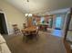 Open-concept kitchen with stainless steel appliances, an island, and a dining area with ample seating at 2635 Red Admiral Ln, Lebanon, IN 46052
