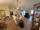 Comfortable living room with ceiling fan, neutral paint, and access to multiple areas of the home at 2635 Red Admiral Ln, Lebanon, IN 46052