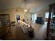 Comfortable living room with ceiling fan, neutral paint, and access to multiple areas of the home at 2635 Red Admiral Ln, Lebanon, IN 46052