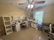Well-lit craft room features multiple desks, ample storage, and a comfortable workspace at 2635 Red Admiral Ln, Lebanon, IN 46052