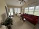 Bright sun room features vaulted ceilings, large windows, and comfortable seating, creating a cozy and inviting space at 2635 Red Admiral Ln, Lebanon, IN 46052