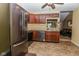 Kitchen with stainless steel appliances, cherry cabinets, and tile flooring at 270 Rapid Rill Ln, Brownsburg, IN 46112