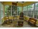 Bright sunroom with lots of windows and varied seating at 270 Rapid Rill Ln, Brownsburg, IN 46112