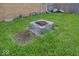 Backyard featuring a brick fire pit in a grassy lawn at 3510 E 34Th St, Indianapolis, IN 46218