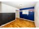 Cozy bedroom with hardwood floors and colorful accent wall at 3510 E 34Th St, Indianapolis, IN 46218
