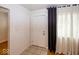 Inviting foyer with tiled floors and ample natural light streaming through the window at 3510 E 34Th St, Indianapolis, IN 46218