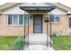 Close up of the covered front porch featuring a security door and house number at 3510 E 34Th St, Indianapolis, IN 46218