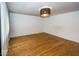 Bright living room featuring hardwood floors and a stylish light fixture at 3510 E 34Th St, Indianapolis, IN 46218