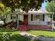 Charming single-story home featuring a cozy front porch and well-maintained lawn at 3528 Orchard Ave, Indianapolis, IN 46218
