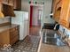 Functional kitchen with stainless steel sink and appliances; ready for everyday cooking at 3528 Orchard Ave, Indianapolis, IN 46218