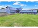 Spacious backyard with lush green grass, patio seating, and well-maintained landscaping at 3682 S 380 E, Anderson, IN 46017