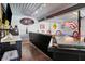 Entertainment bar area equipped with sleek countertops, fun decor, and room for activities and refreshments at 3682 S 380 E, Anderson, IN 46017