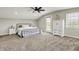 A bright bedroom with a spacious layout, a ceiling fan, and a white dresser at 3682 S 380 E, Anderson, IN 46017