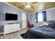 A comfortable bedroom with stylish décor, wooden ceiling and ample space for relaxation at 3682 S 380 E, Anderson, IN 46017