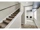 Entryway with a set of stairs and bench with storage, and a modern rug at 3682 S 380 E, Anderson, IN 46017