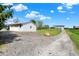 Quaint white garage and gravel driveway leading to a country home at 3682 S 380 E, Anderson, IN 46017
