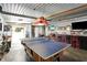 Spacious game room featuring a ping pong table, bar area, and unique decor for entertainment at 3682 S 380 E, Anderson, IN 46017