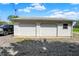 Detached two-car garage with white siding and a gravel driveway at 3682 S 380 E, Anderson, IN 46017
