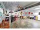 A spacious garage with a bar, pool table, and ample room for storage and entertainment at 3682 S 380 E, Anderson, IN 46017