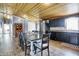 Spacious kitchen and dining area with wood floors and a unique wood ceiling at 3682 S 380 E, Anderson, IN 46017