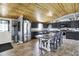 Stylish kitchen with black cabinets, stainless steel appliances, and wood ceiling at 3682 S 380 E, Anderson, IN 46017