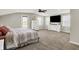 Relax in this primary bedroom featuring carpet and a large TV at 3682 S 380 E, Anderson, IN 46017