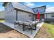 Stylish backyard patio with comfortable couches and a picnic table with an umbrella at 3682 S 380 E, Anderson, IN 46017