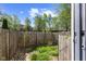 Fenced backyard offering green space, privacy, and a gate for access at 3705 Lima Ct, Indianapolis, IN 46227